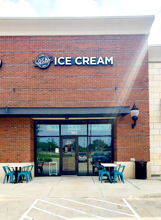 Image of Local Creamery storefront with open tables and chairs out front.