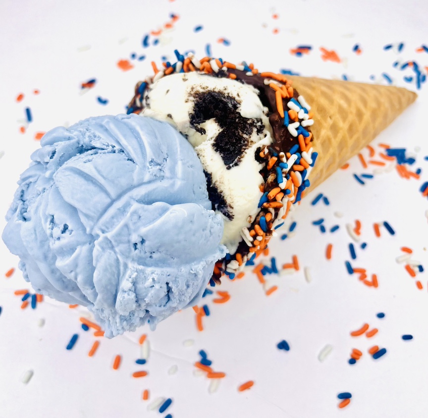 Image of a double scoop ice cream cone with sprinkles.